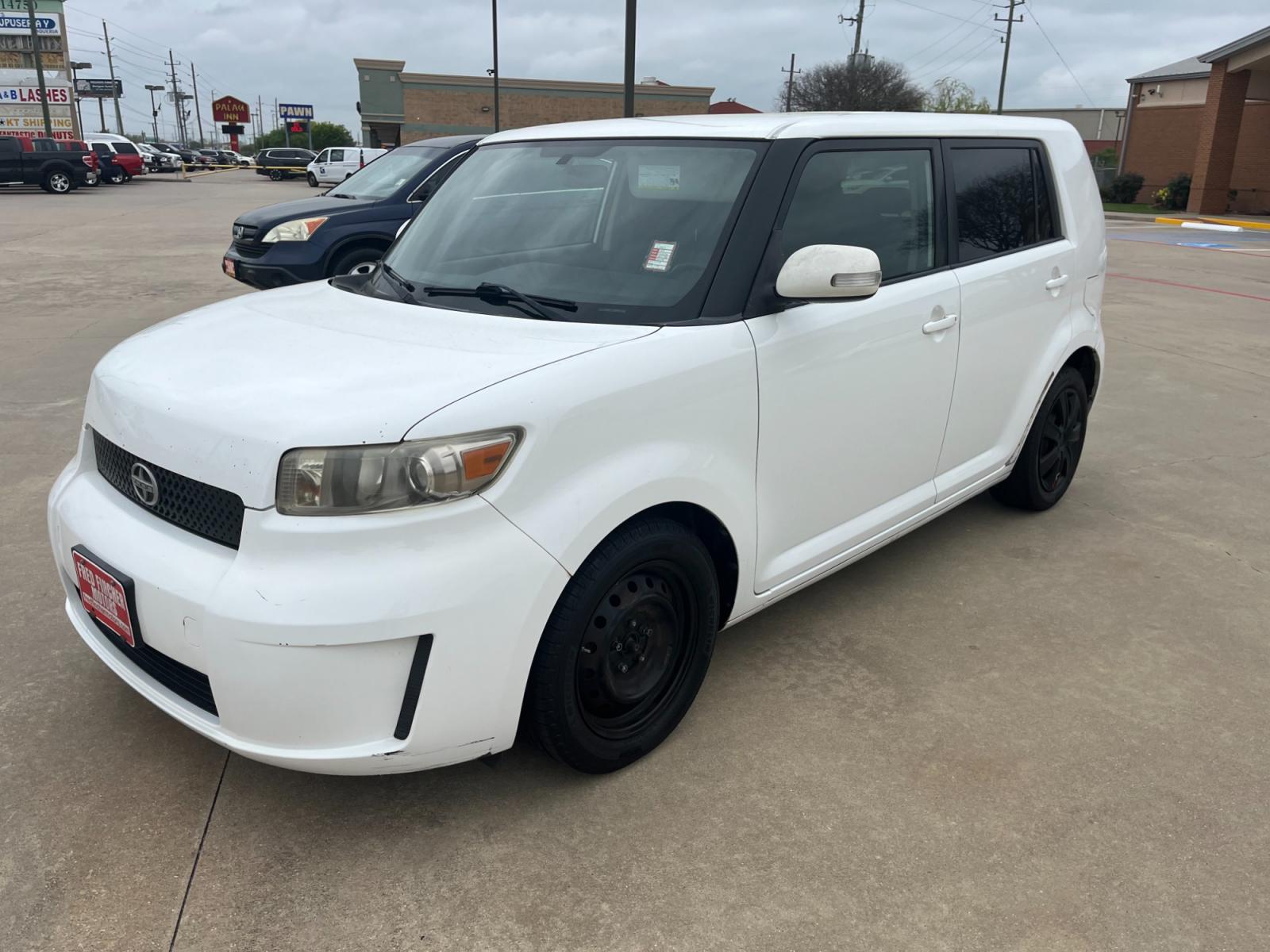 2009 white /black Scion xB Wagon (JTLKE50E591) with an 2.4L L4 DOHC 16V engine, Automatic transmission, located at 14700 Tomball Parkway 249, Houston, TX, 77086, (281) 444-2200, 29.928619, -95.504074 - Photo #2